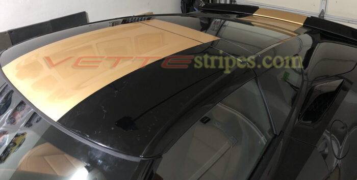 Black C7 Stingray with gloss gold center stripes