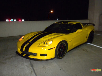 yellow C6 Corvette Z06 with black racing 2 stripe