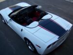 Arctic white C6 Corvette convertible with black and red ME stripes