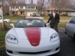 Arctic white C6 Corvette convertible with red and gunmetal ME stripe