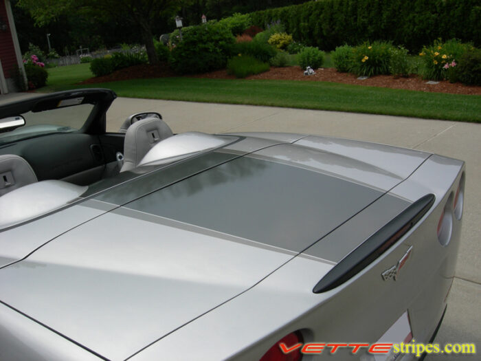 Machine silver C6 Corvette convertible with medium charcoal and charcoal ME stripes