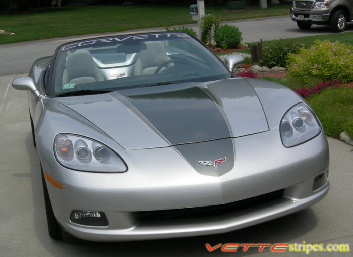 Machine silver C6 Corvette convertible with medium charcoal and charcoal ME stripes