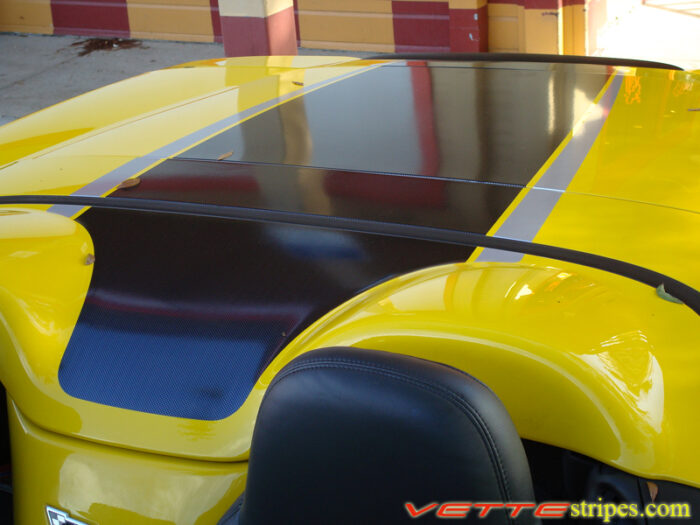 Yellow C6 Corvette convertible with black carbon fiber and silver ME stripe