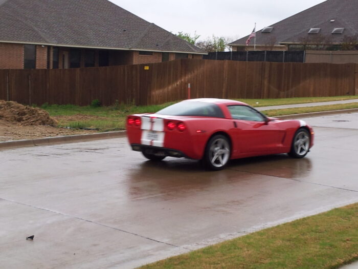 Red C6 Corvette with white racing stripe 2
