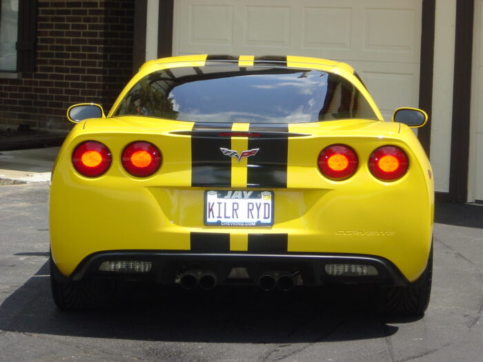 Yellow C6 Corvette with black racing stripe