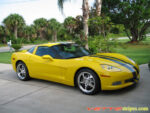 Yellow C6 Corvette with metallic dark charcoal racing stripe