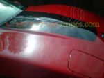 Red C4 Corvette with gloss black classic stripe
