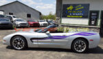 Silver C5 Corvette convertible with side stripes graphic