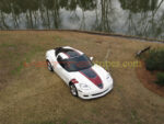 White C6 Corvette Grand Sport with black and metallic maple GT1 stripes