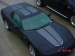 Black C5 Corvette with gunmetal and silver CE commemorative stripes