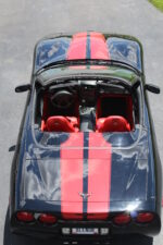 Black C5 Corvette with red CE commemorative stripe