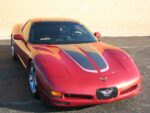 Magnetic red C5 Corvette with gunmetal and silver CE commemorative stripes