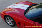 Red C5 Corvette convertible with white racing stripe style 3