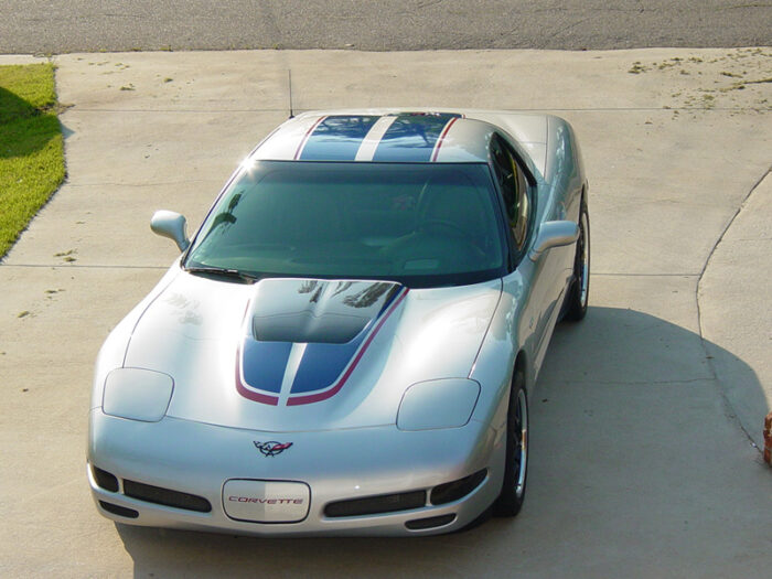 Silver C5 Corvette Z06 with grand blue and red MCM hood stripe