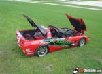 C5 Corvette torch red coupe with white racing stripe