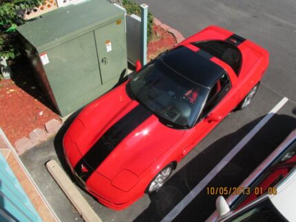 Torch red C5 Corvette with black Grand Sport stripe