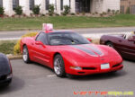 Torch red C5 Corvette with gunmetal and silver CE commemorative stripes