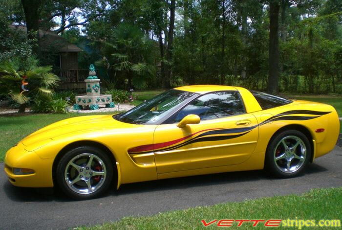 Yellow C5 Corvette with black and red side stripe graphic