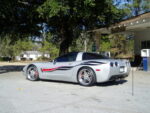Silver C5 Corvette with black red side stripes graphic