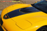 Yellow C5 Corvette with black and dark charcoal GT1 stripe and optional extended rear