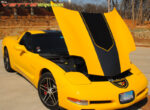 Yellow C5 Corvette with black and dark charcoal GT1 stripe