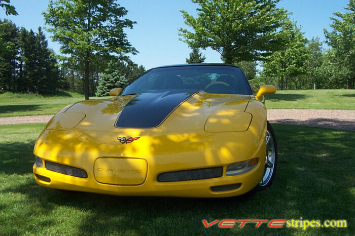 Yellow C5 Corvette with black classic stripes