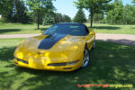 Yellow C5 Corvette with black classic stripes