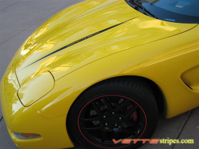 Yellow C5 Corvette with black hood spear stripe