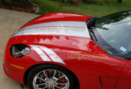 Red C6 Corvette convertible with metallic silver grand sport fender hash marks stripes
