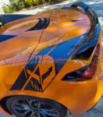 Amplified Orange C8 Corvette Stingray with Gloss carbon fiber Stingray R rear fender hash marks