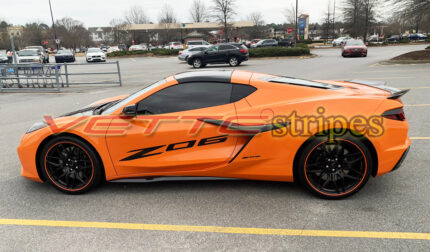 Amplified orange C8 Corvette Z06 with Z06 door script in 3M 2080 gloss carbon flash