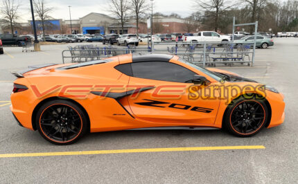 Amplified orange C8 Corvette Z06 with Z06 door script in 3M 2080 gloss carbon flash