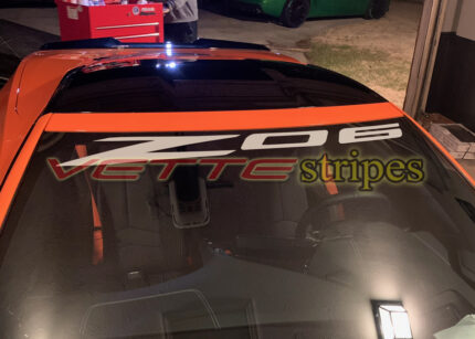 Amplified orange C8 Corvette Z06 with Z06 windshield script