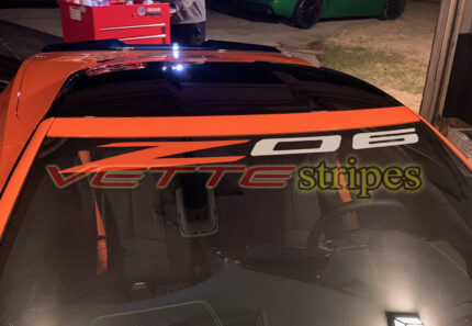 Amplified orange C8 Corvette Z06 with Z06 windshield script in amplified orange and silver
