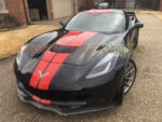 Black C7 Corvette Grand Sport with racing stripes in gloss torch red