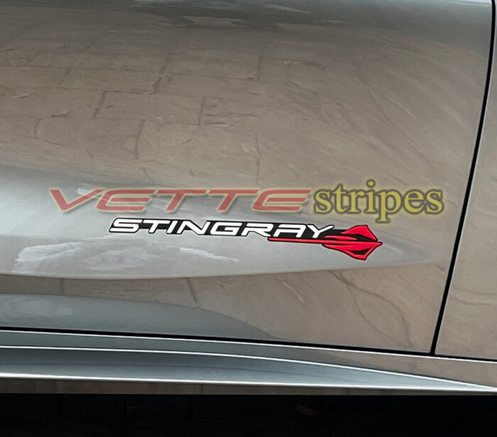 C8 Corvette Stingray logo in gloss white and torch red with gloss carbon flash background