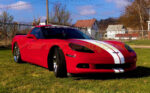 Red C6 Corvette coupe with full length dual racing 3