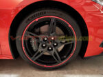 Torch red C8 Corvette with wheel pinstripes