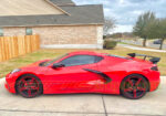 Torch red C8 Corvette with wheel pinstripes and open spoke wheel decals